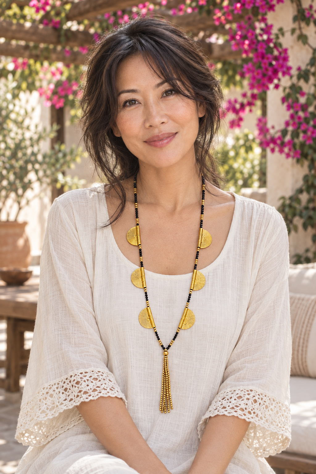 AI-styled waist-up photograph of Tiffany wearing the jewelry in a sunlit courtyard
