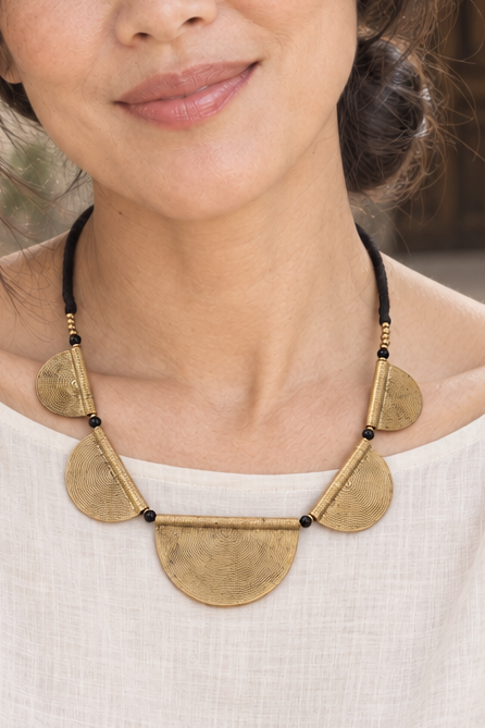 AI-styled waist-up photograph of Tiffany wearing the jewelry in a sunlit courtyard